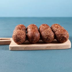 carob peanut butter balls on cutting board